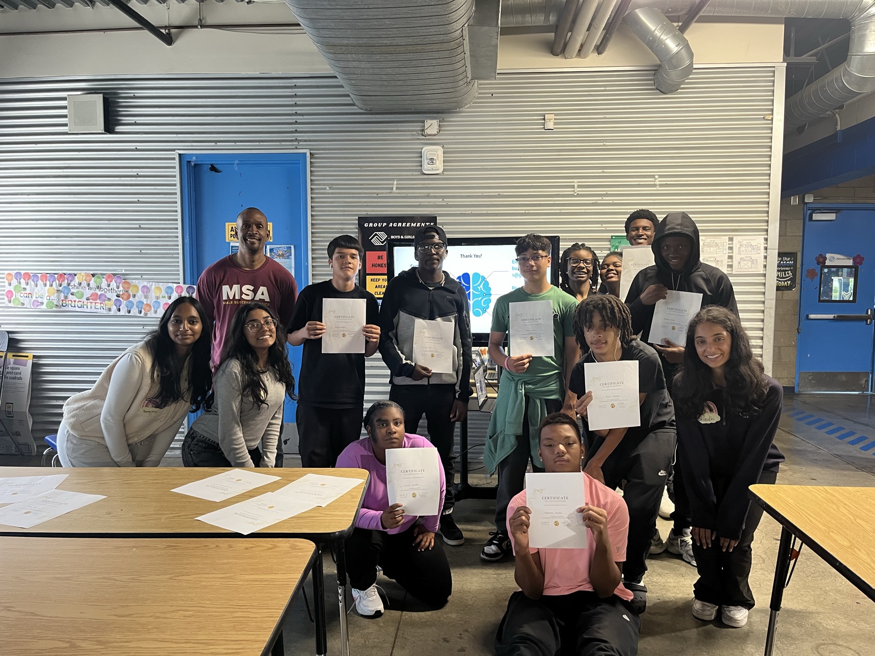 Peace4Kids workshop participants holding certificates